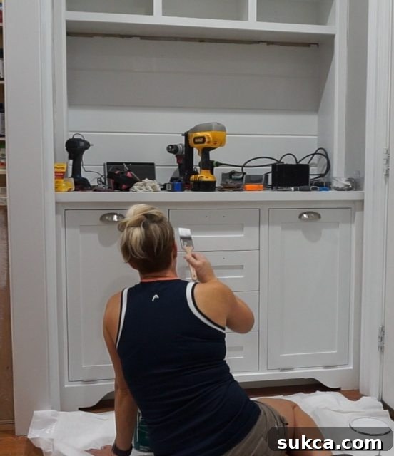 Perfectly Aligned Drawer Fronts on Hutch A wide shot of the kitchen hutch with all drawer fronts perfectly spaced and secured, showcasing the challenging but successful alignment of the inset drawer fronts after numerous adjustments.