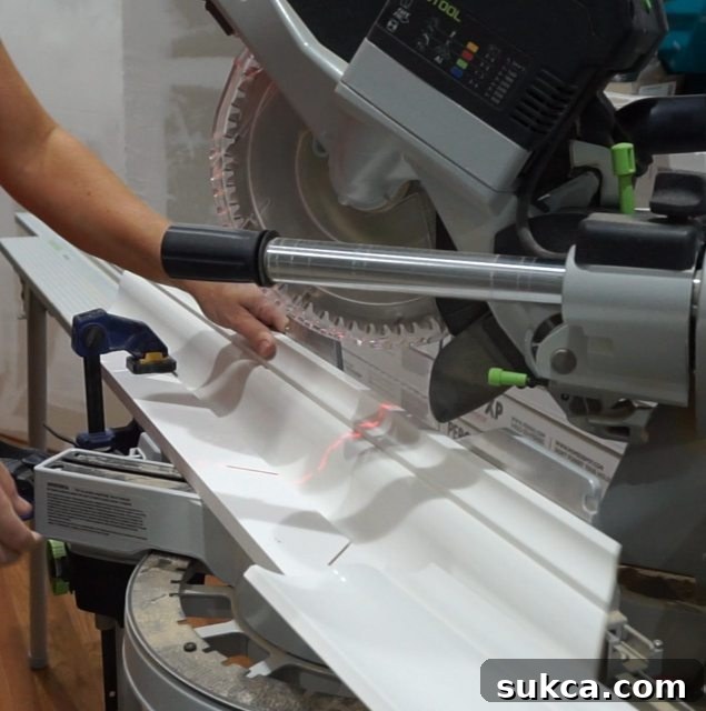 Using a shop-made crown molding jig for precise cuts on Metrie trim
