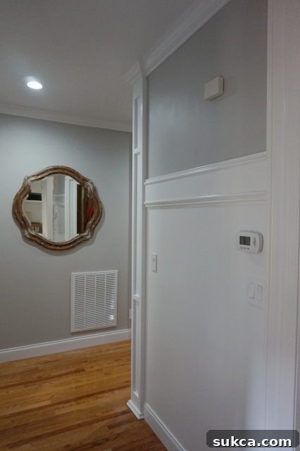 Wide view of the hallway showcasing the new decorative column and its elegant integration