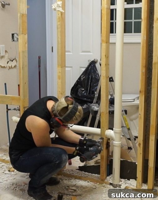 Cutting studs around plumbing pipes