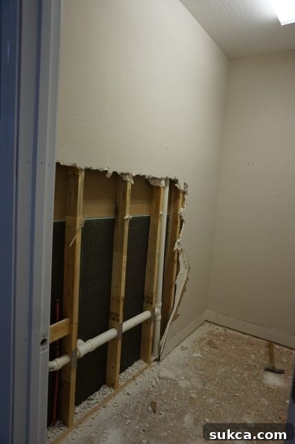 Exposed plumbing and electrical during demolition