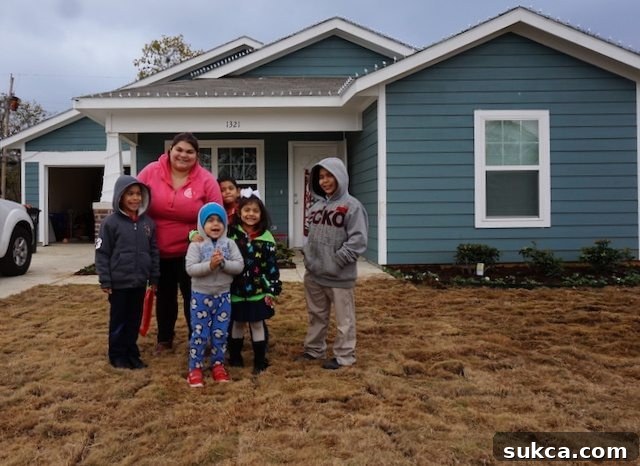 A festive neighborhood built through Lowe's and Habitat for Humanity, adorned with holiday lights