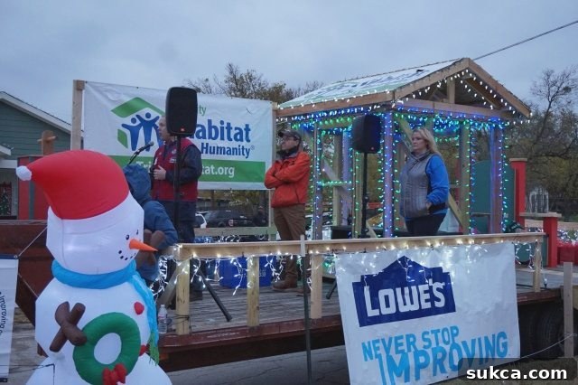 Lowe's and Habitat for Humanity signage with the motto 'Never Stop Improving'