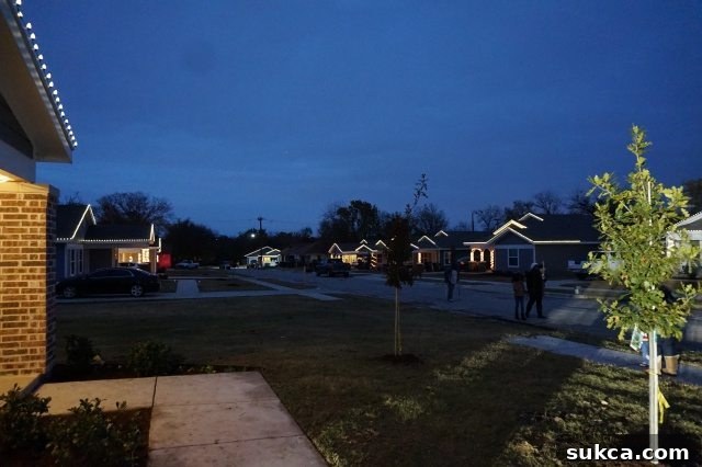 Festive lights illuminating a home built by Lowe's and Habitat for Humanity