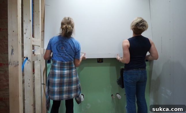 Standard Sheetrock Progress Installing standard sheetrock on bathroom walls in areas without direct water exposure
