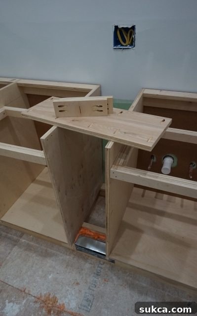 The central section of the vanity, featuring bottom and cleat construction Central Vanity Section Construction with Cleats