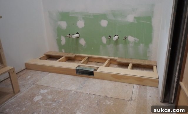 Vanity base with added height to clear future flooring and toe-kick Elevated Vanity Base for Floor Clearance