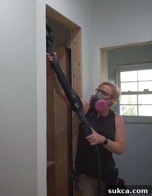 Planex Drywall Sander on Proud Stud Using a Planex drywall sander on the cabinet opening, still struggling with the stud