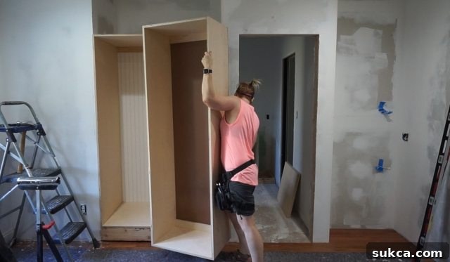 Installing the First Wardrobe Cabinet Securing the first bedroom wardrobe cabinet to the wall
