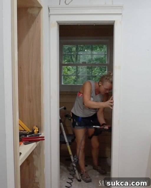 Final installed door casing on the interior of the water closet