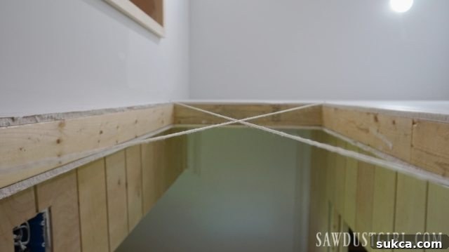 Checking the rough opening for door installation with a level