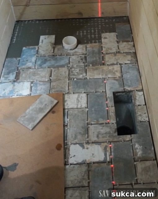 Completed tiling in the back of the room Finished back section of tile installation