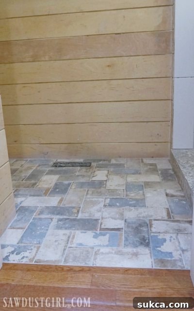 Close-up of the flush tile to hardwood join Detail of flush tile and hardwood floor transition