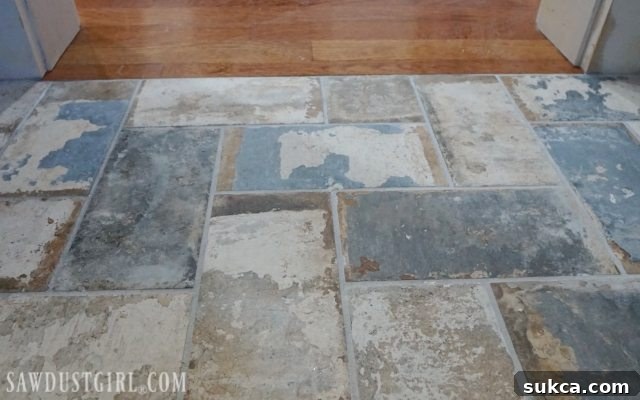 The seamless bathroom floor transition Final view of the flush tile with hardwood floors
