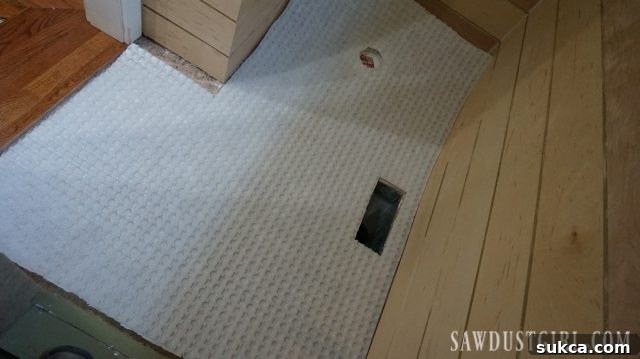 Cutting STRATA_MAT XT to fit around obstacles Preparing STRATA_MAT XT for tile installation