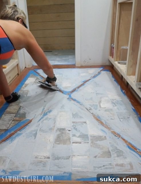Wood Floor with Tile Inlay grouting technique Spreading Grout with a Float on Brick Tile Inlay