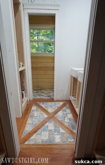 Final look of wood floor with tile inlay Stylish Wood Floor and Brick Tile Inlay in Modern Bathroom