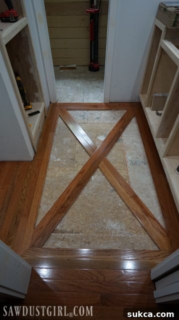 Wood floor with brick tile inlay closeup Close-up of Wood and Tile Inlay Pattern Before Installation