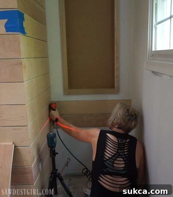 Continuing plank installation around room