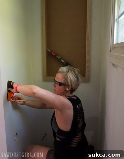 Marking studs for plywood plank installation