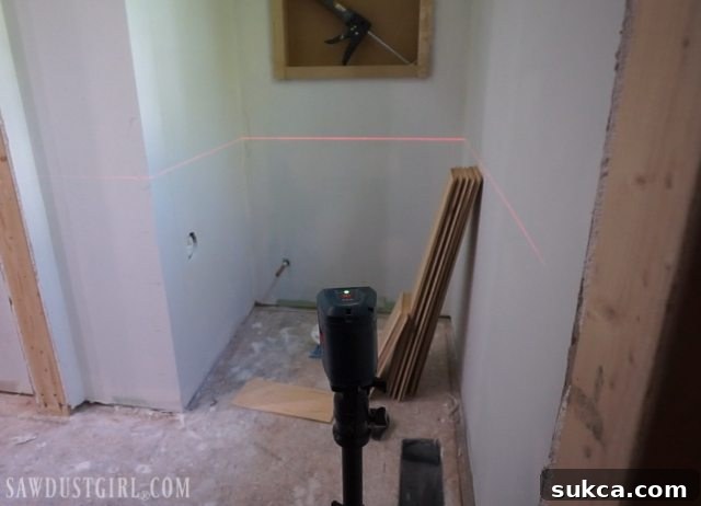 Using a laser level for plank wall installation