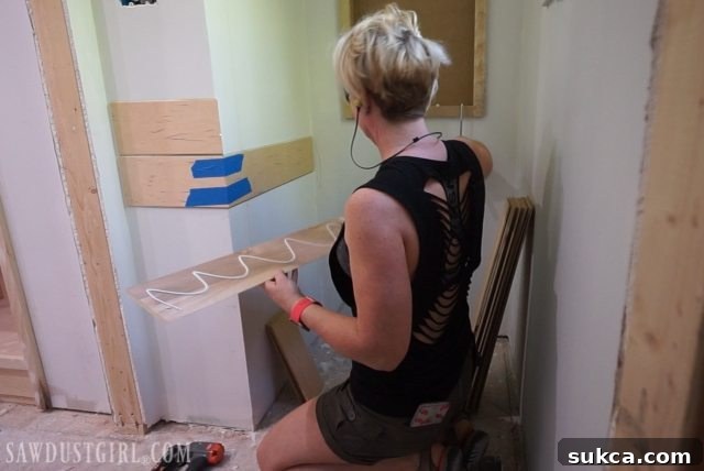 Applying adhesive and pin nails for plywood planks