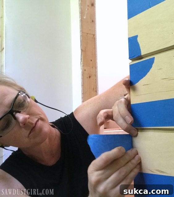 Using painter's tape to secure corner joint