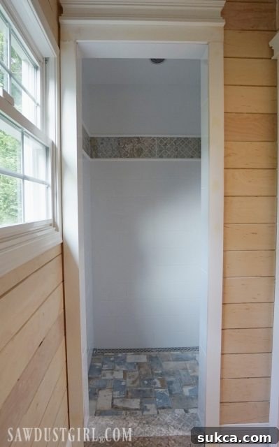Newly Tiled Shower Wall Detail Shower Tile: A close-up view of the pristine, newly tiled shower wall, awaiting fixtures and glass enclosure.