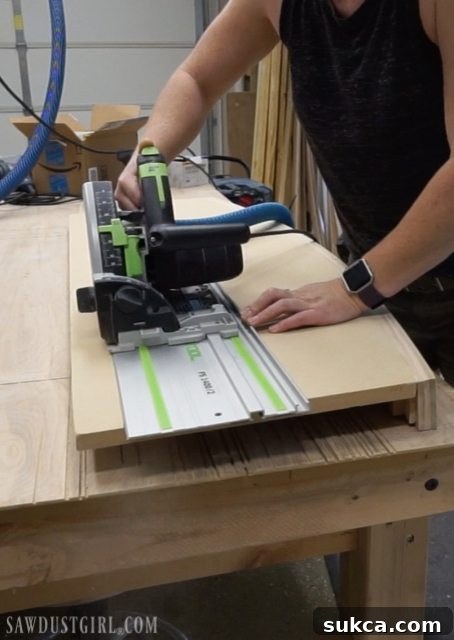 Trimming the back edge of a curved floating desk with a track saw for a precise final depth