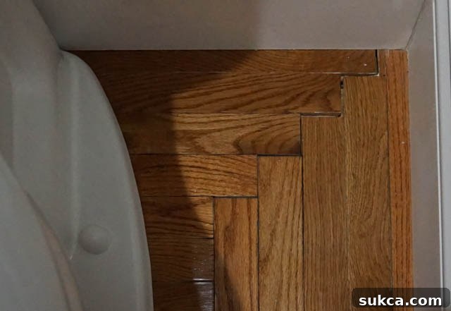 Water-damaged hardwood floor, a consequence of severe plumbing issues