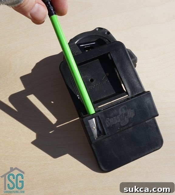 FastCap Tape Measure Holder with built-in pencil sharpener in action