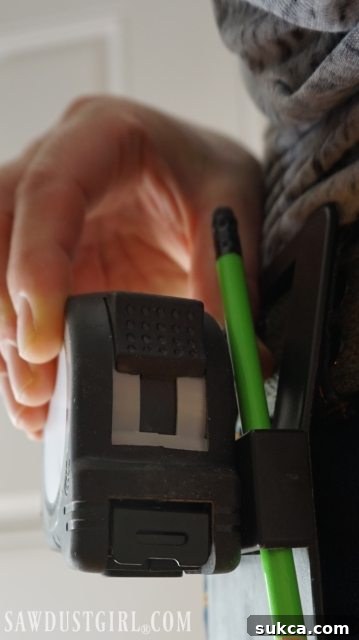 Easy access tape measure holder demonstrating ergonomic design