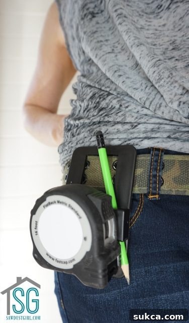 Speed Clip Tape Measure Holder with a tape measure clipped in place
