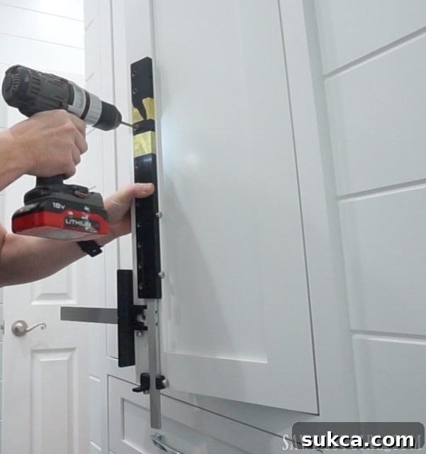 Another view of the jig set up for wide drawer fronts, demonstrating how the extension arm provides extra reach.