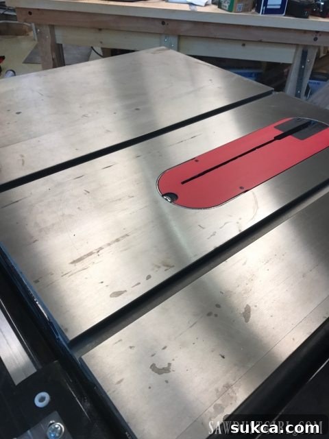 Cleaning surface rust from a table saw top using WD-40 and steel wool