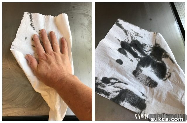 Wiping away rust residue and excess WD-40 from cleaned tool surfaces