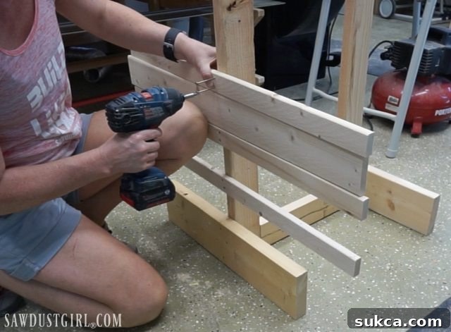 Using a spacer block for consistent drying rack arm spacing