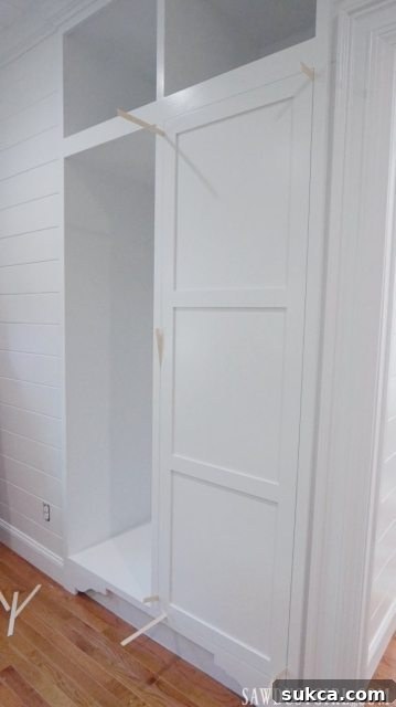 Integrated Storage for Compact Bedrooms 5 Expertly installing CabinetNow custom doors for a built-in tiny closet.