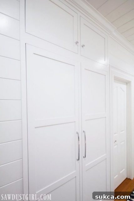 Integrated Storage for Compact Bedrooms 7 Revealing the beautifully built-in tiny closet, optimized for guest bedroom storage.