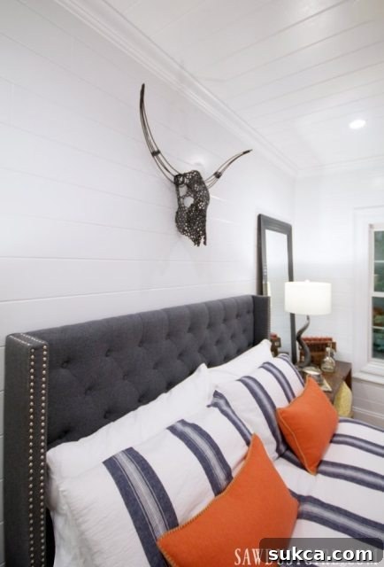 Detailed shot of the guest bedroom remodel, highlighting the unique steer head decor and inviting textures.