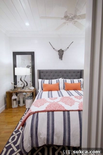 An inspiring view of the guest bedroom design, featuring cohesive styling and smart space utilization.