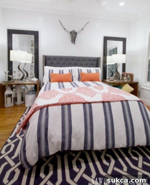 Reflective surfaces and smart decor in the little guest bedroom design, enhancing space and style.