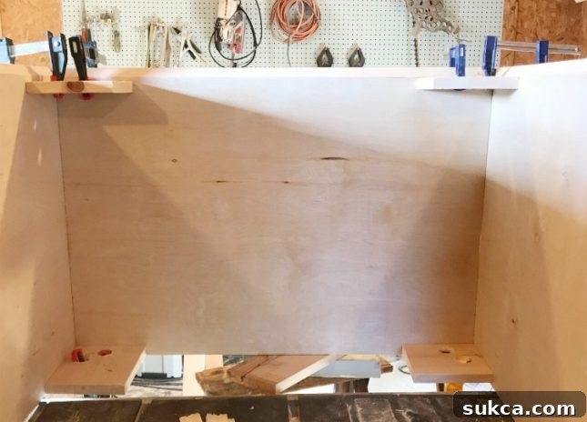How to use clamping jigs to create cabinets with three mitered corners
