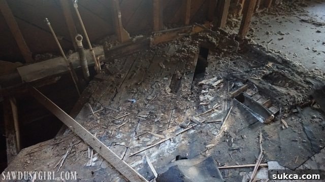 Dry rot damage from water leaks affecting hardwood floors in Calderwood Cottage bathroom and kitchen areas