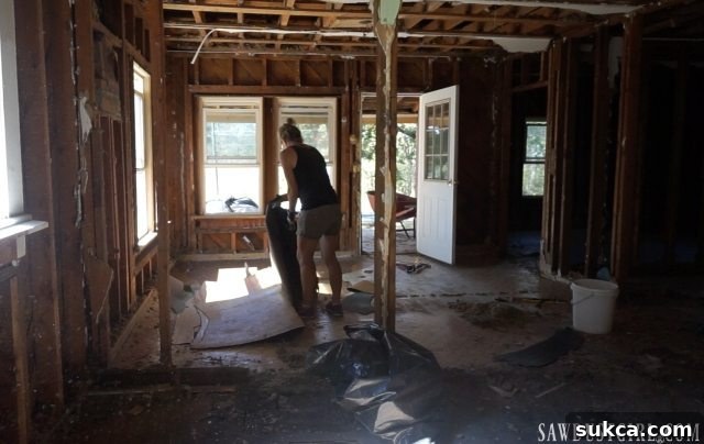 Stacked layers of linoleum, nails, and staples removed from Calderwood Cottage floor