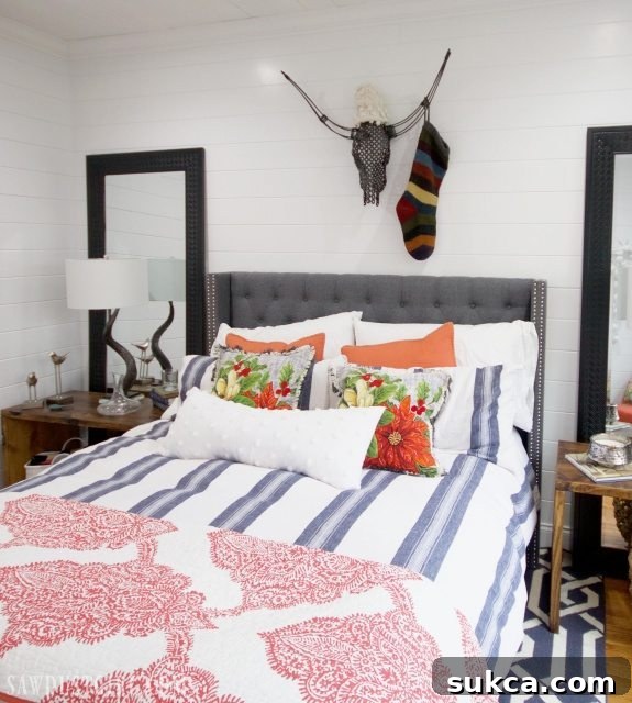 Stylish guest room with a unique skull decoration adorned with a Christmas stocking and hat.