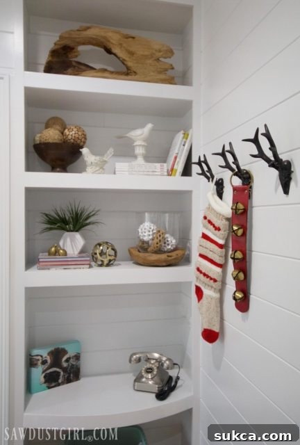 Decorative hooks in guest room with a stocking and sleigh bells, adding holiday cheer.