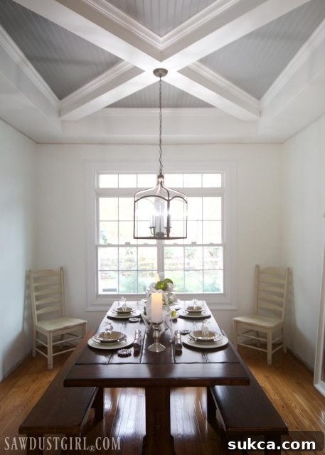 Dining room table set with festive Christmas decorations, including reindeer ornaments.