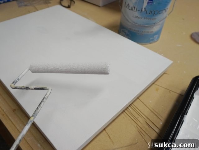 Rolling primer on plywood for optimal paint adhesion