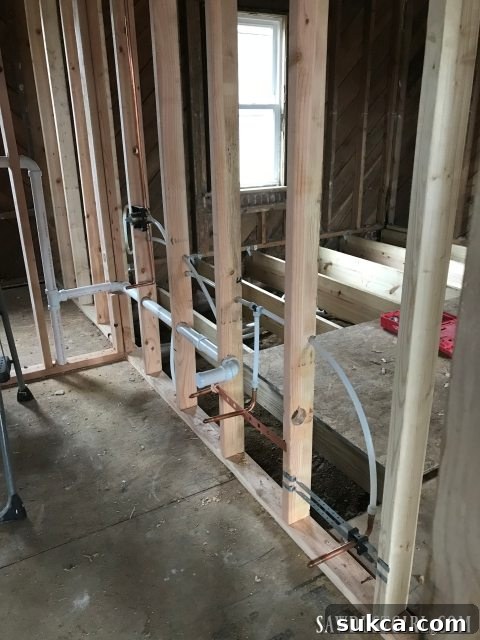 New plumbing lines being installed Plumbing rough-in installation at Calderwood Cottage